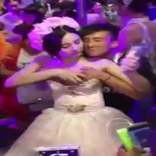 Chinese bride allows guests to molest her during the ceremony