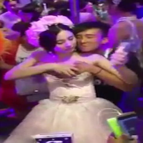 Chinese bride allows guests to molest her during the ceremony