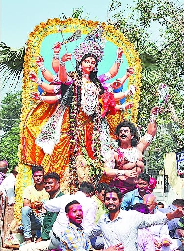 The procession with the statue of Goddess Durga immersed