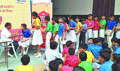 Amar Ujala and put in Dabur Red Tooth Paste  Camp Six hundred students - students of dental checks