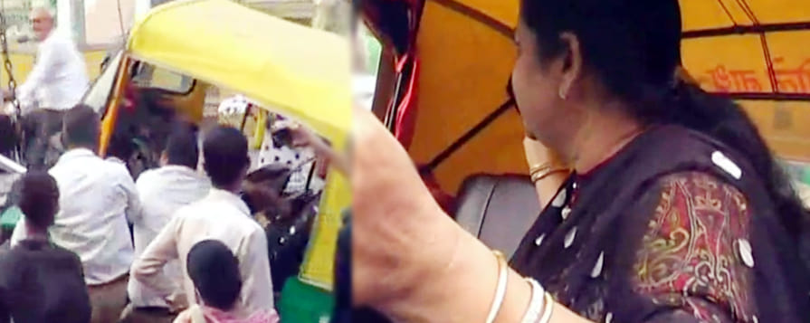 When auto rider women raised by crane