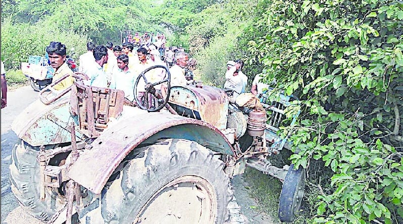 Tractor overturns injured farmer