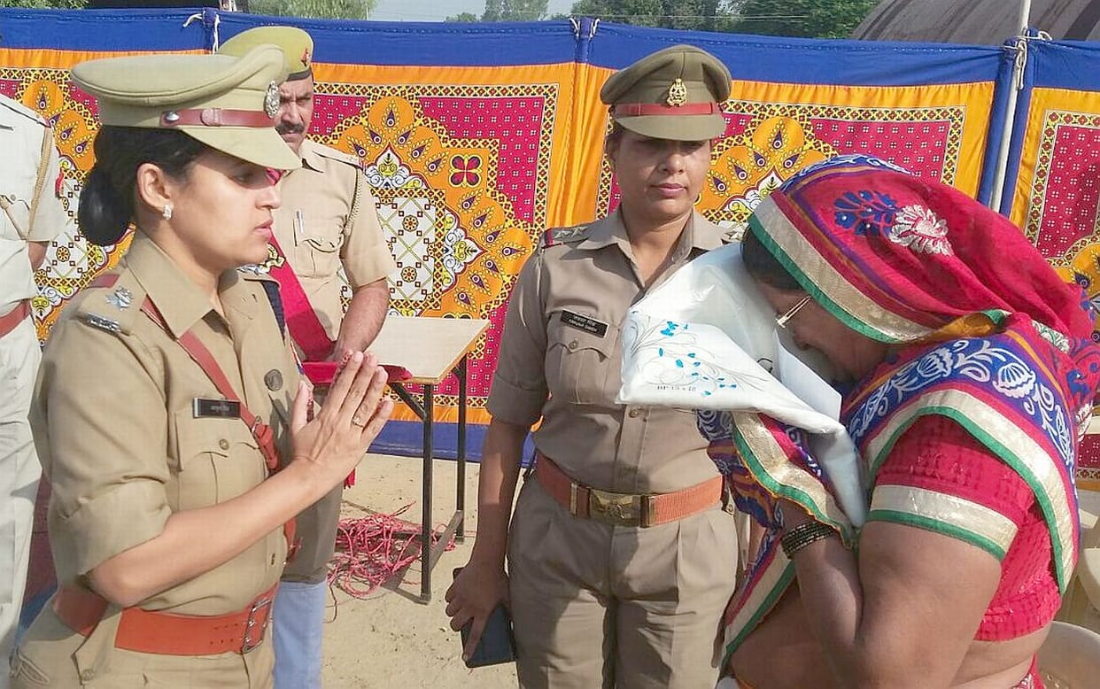 The families of martyred policemen honored.