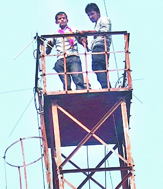 Minda company employee climbed up tower
