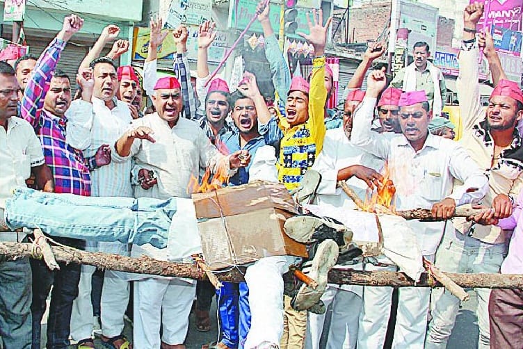 Burned an effigy of Amar Singh