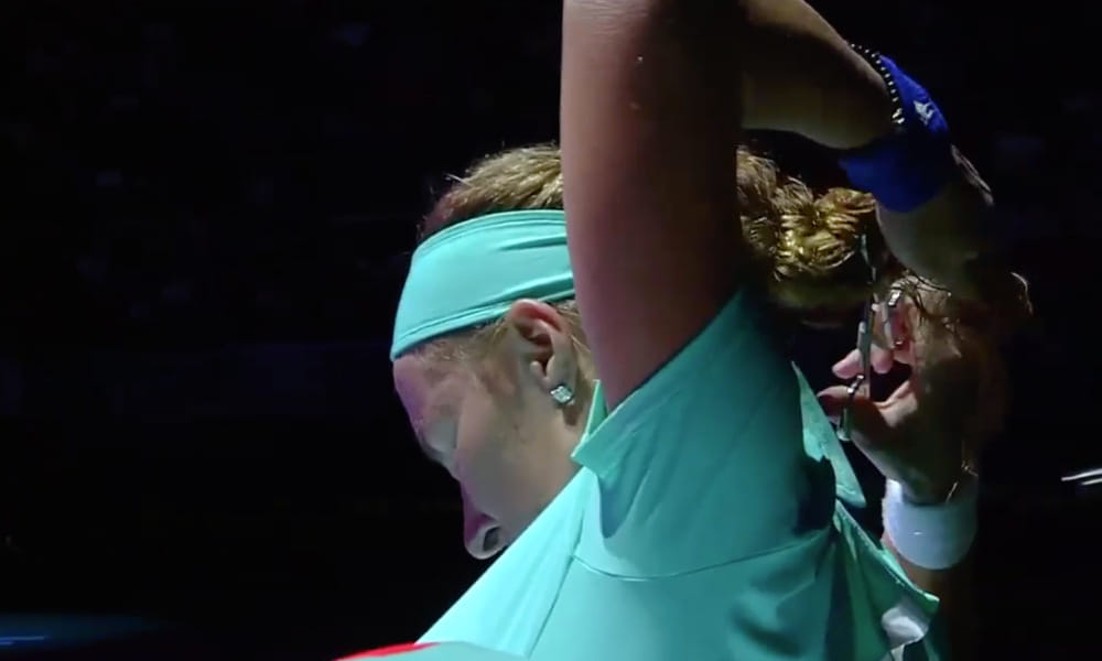 women tennis Player used scissor while playing in the court 