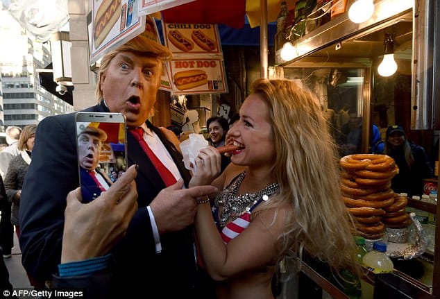 Bikini-Clad Models Surround Fake Donald Trump In New York City Stunt