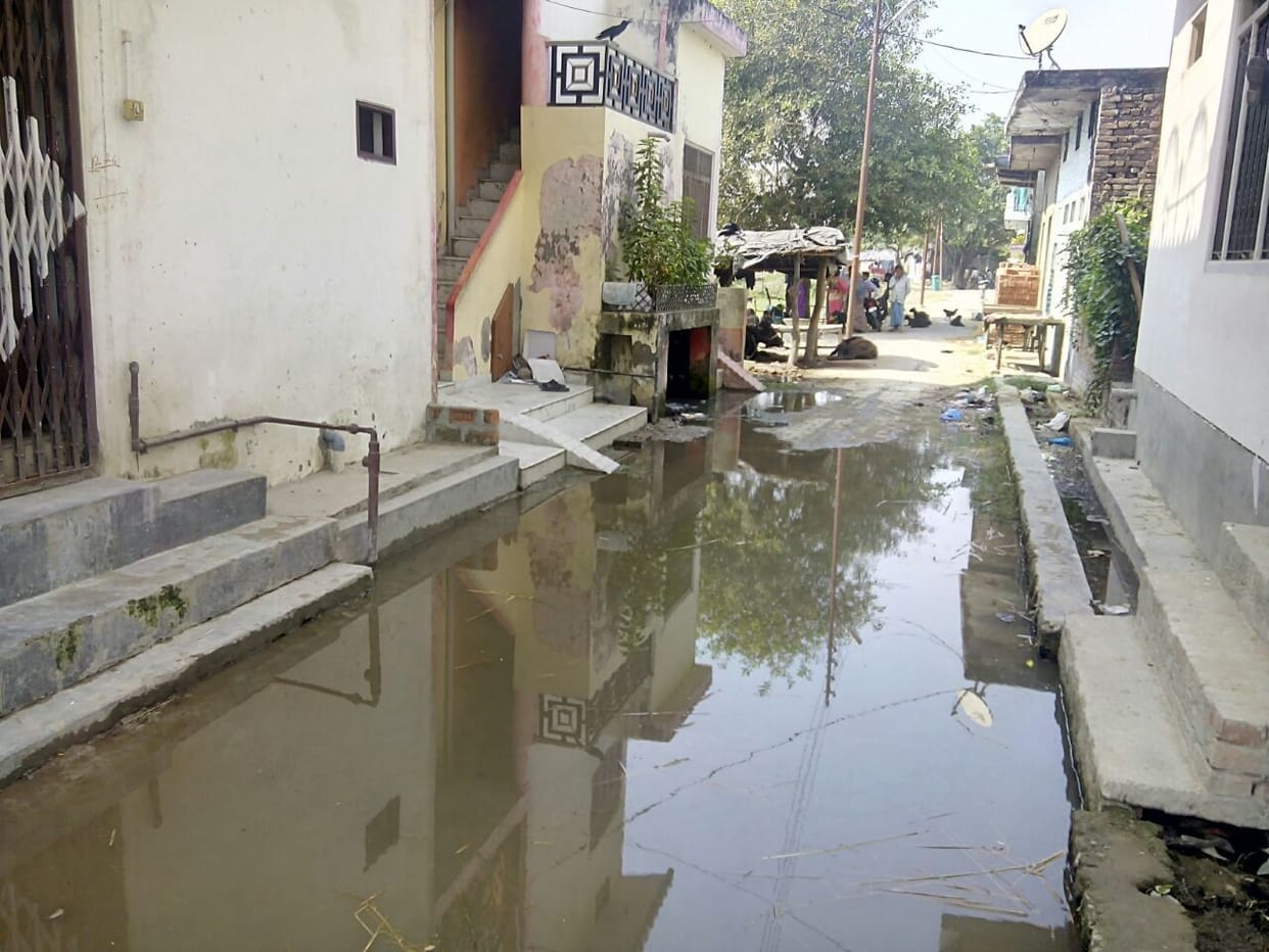 Dirty water is flowing on the road