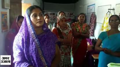 Woman learn needlework for her son in kanpur 