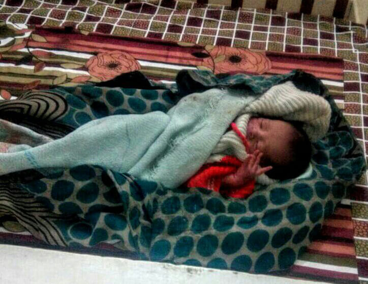 newborn left out side temple