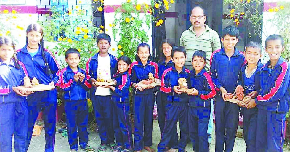 Tknar earthen lamp and sculptures made by children