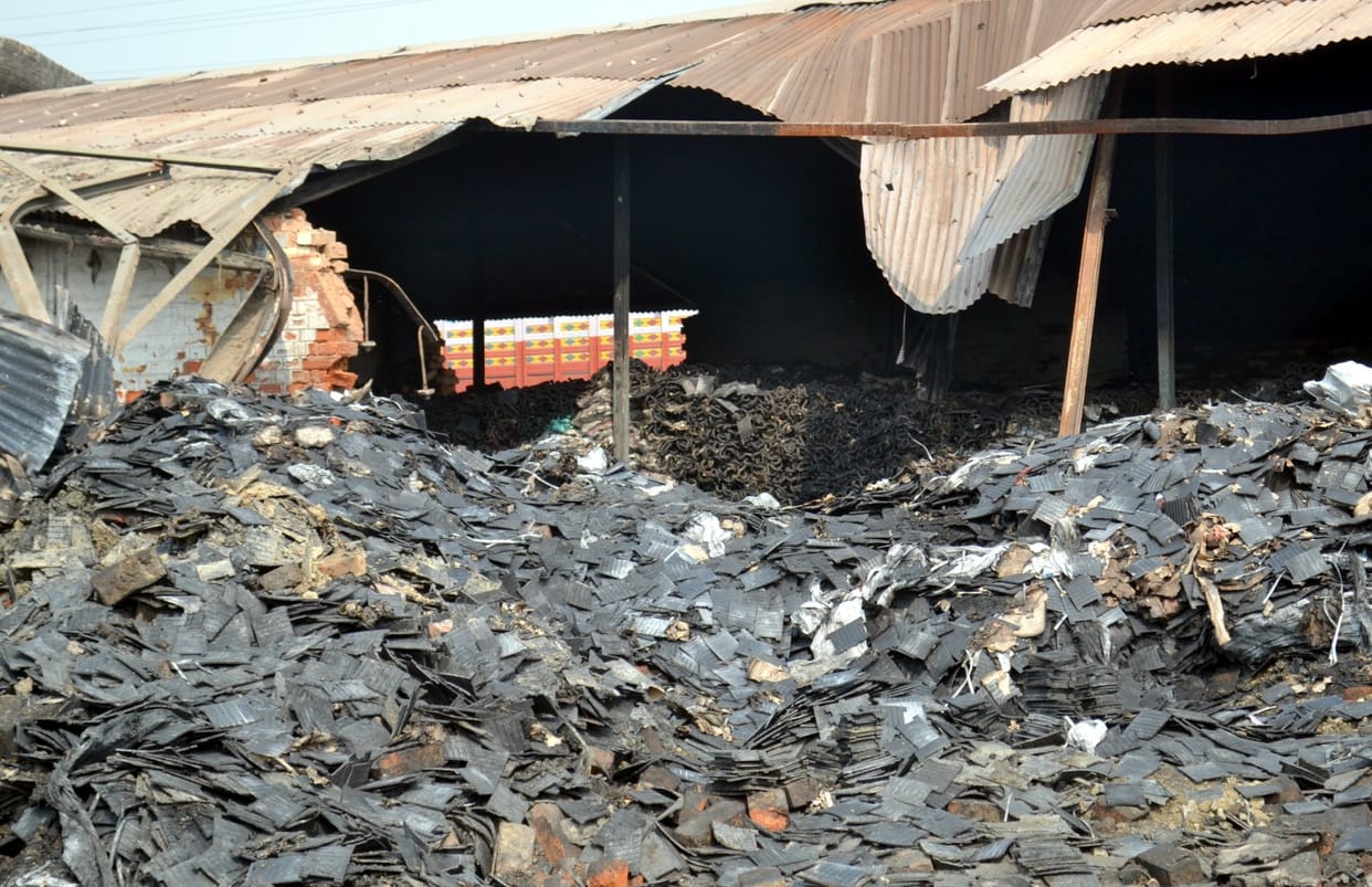 Damage from the fire in warehouse Are assessing officer