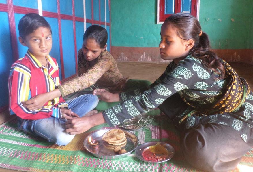 Brothers and sisters put Tilak placed on the head Cude