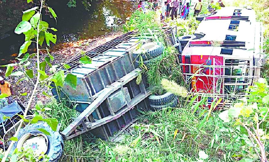 After the collision the bus and a tractor-trolley fell into the river