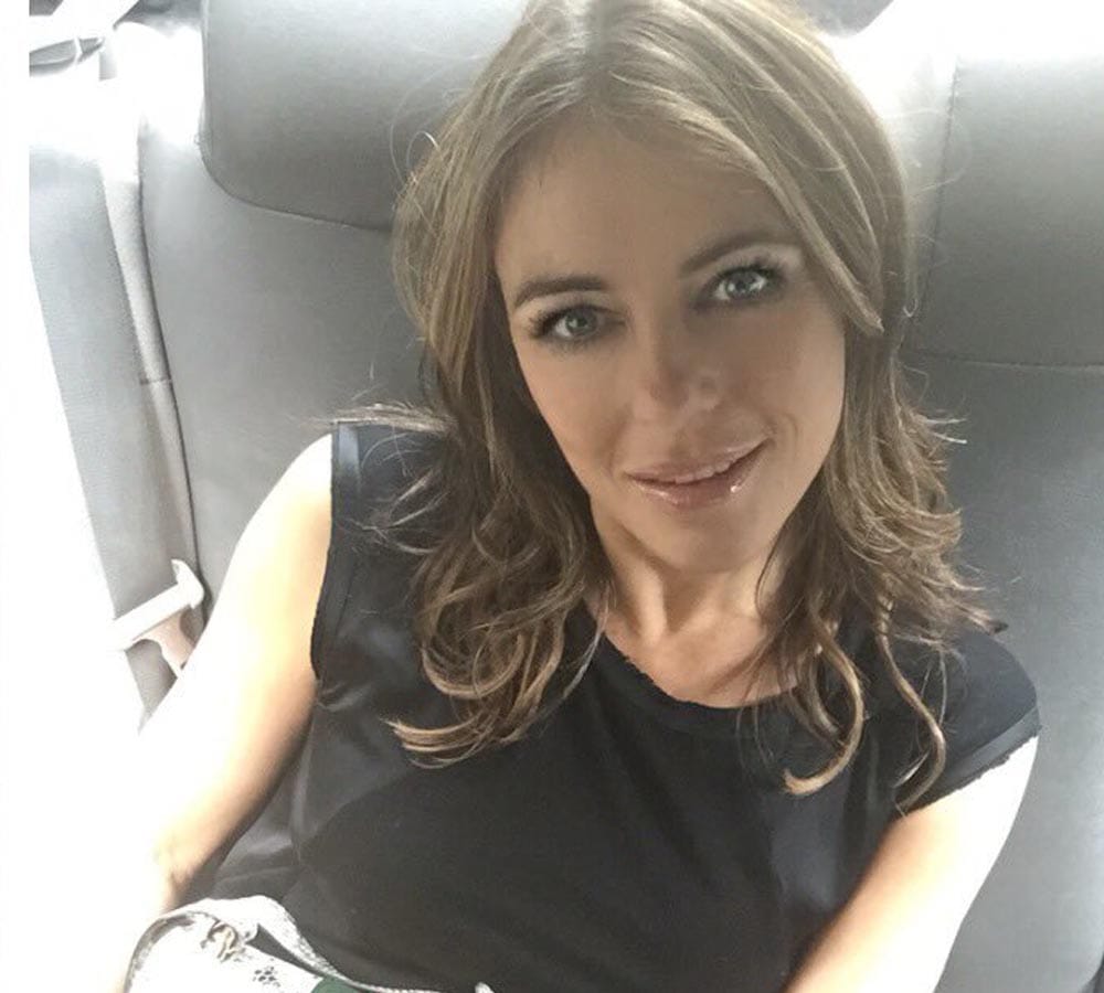 Elizabeth Hurley strips for a bath tub photo