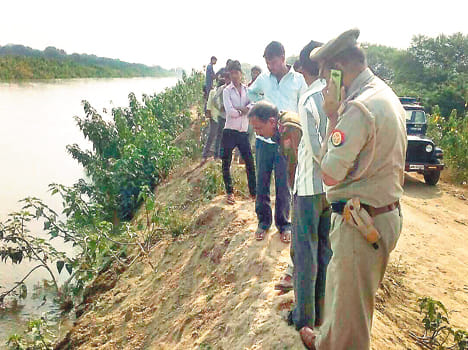 Young man with sharp weapons, killing the body of froth in canal