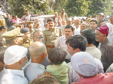 Farmers are crossing the road trodden by truck
