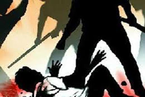 man beaten by sticks poles half dead 