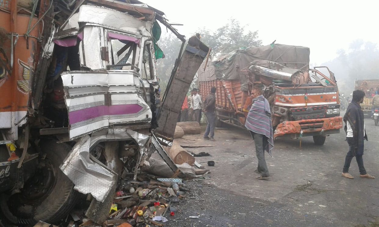 Trucks collide, killing the helper