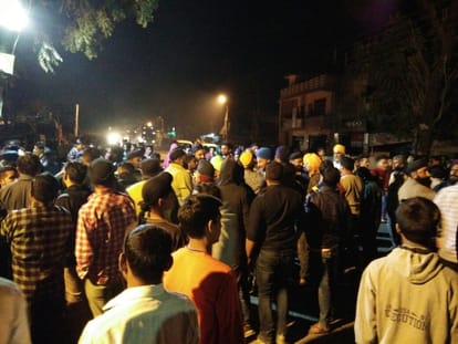 two policemen attached to line on insult of turban.