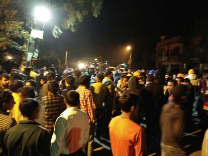 two policemen attached to line on insult of turban.