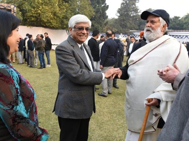Jagdeesh Lal Ahuja, a philanthropist, serve food among the poor outside the PGI