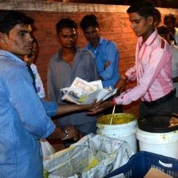 Jagdeesh Lal Ahuja, a philanthropist, serve food among the poor outside the PGI