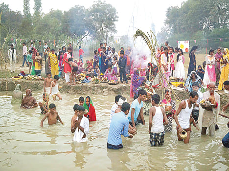 Offer water to the rising sun in fatehpur