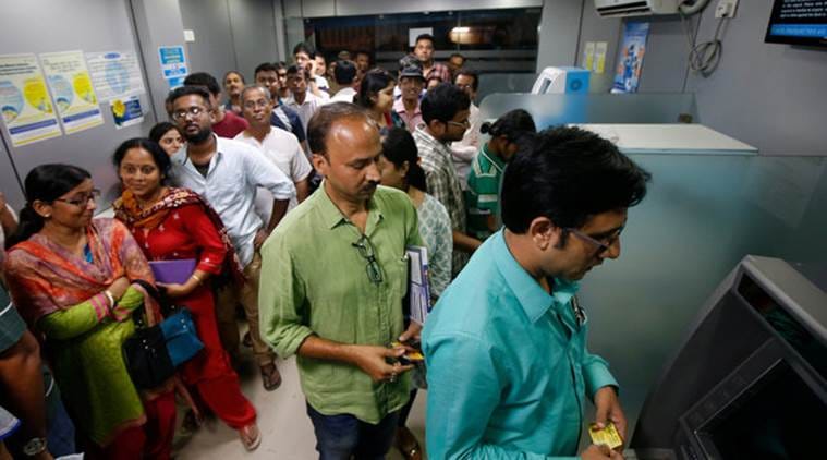 follow rules for money from atm, huge crowd and lines of people outside atm in chandigarh