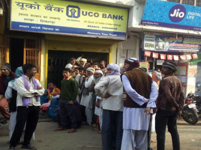 follow rules for money from atm, huge crowd and lines of people outside atm in chandigarh
