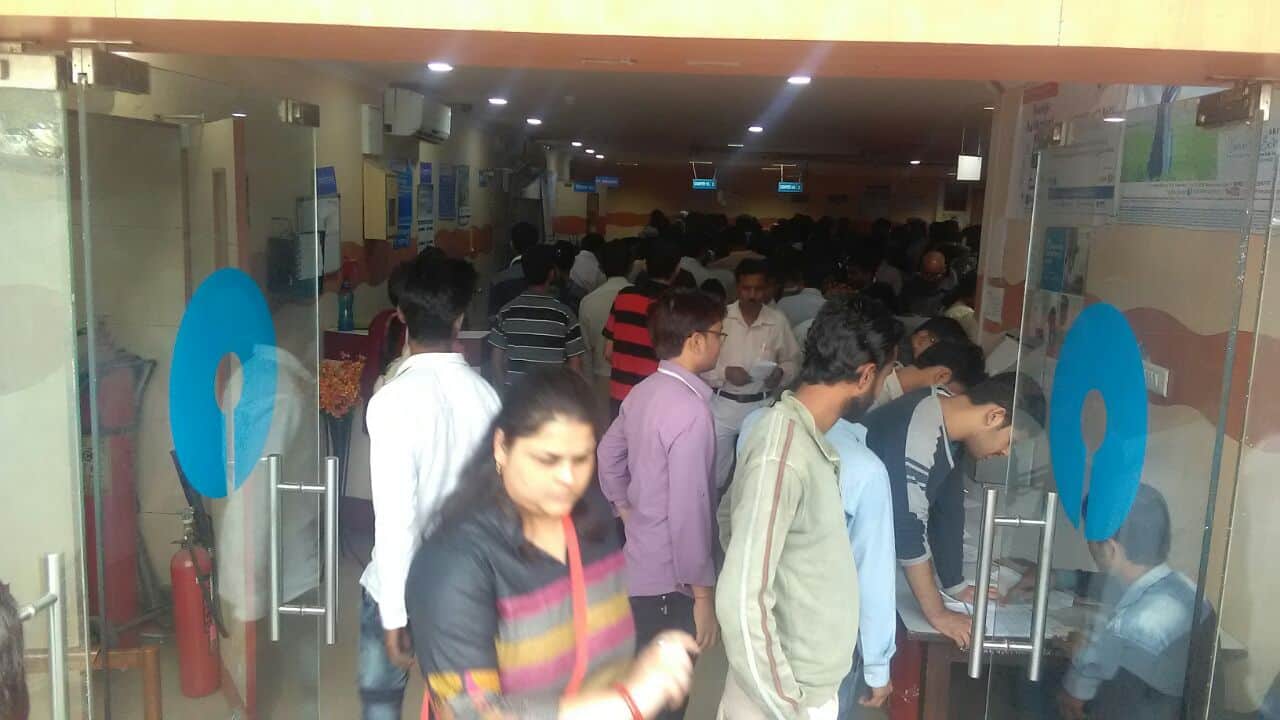 long queue opposite banks for currency exchange
