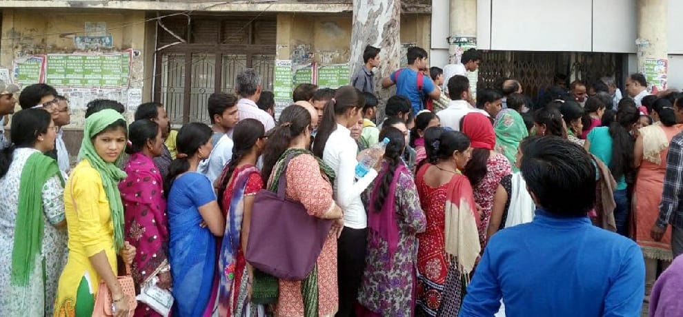 women left all household work and standing in bank queues after demonetization 
