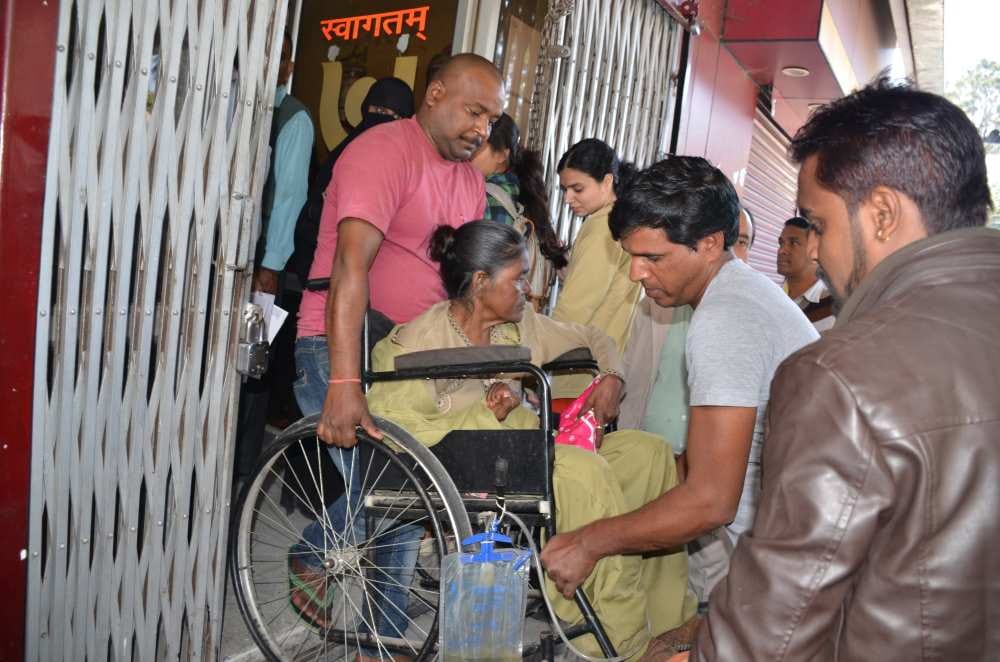 disabled woman in bank queue for husband tehrvi