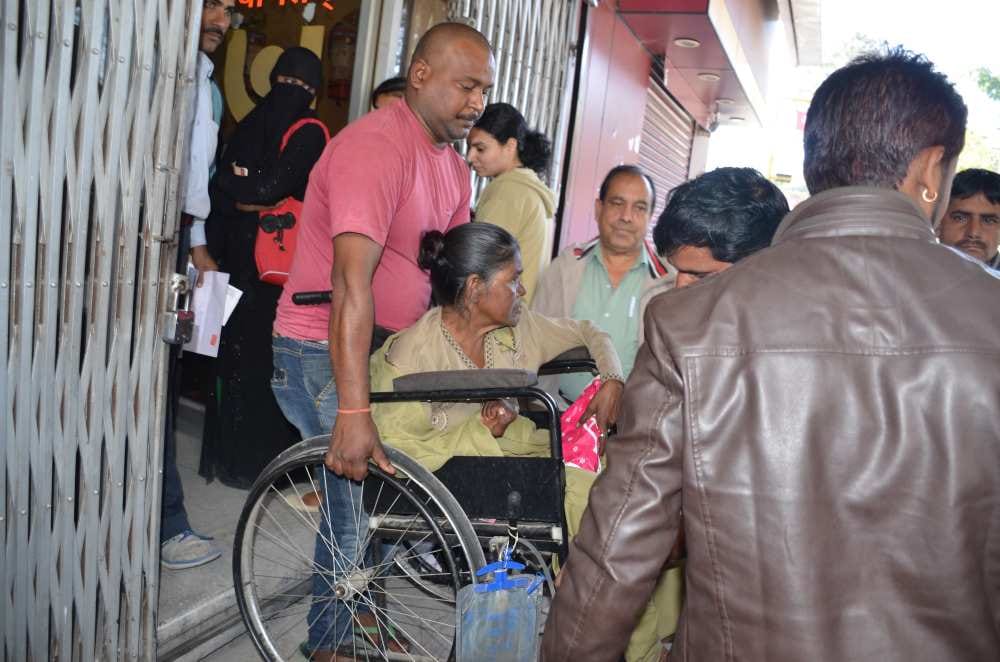 disabled woman in bank queue for husband tehrvi
