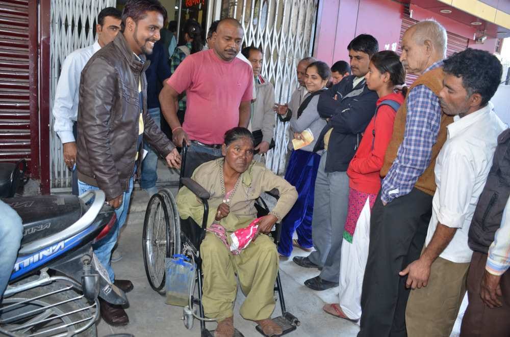 disabled woman in bank queue for husband tehrvi