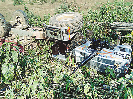 Tractor-trolley upturned, two buried a death