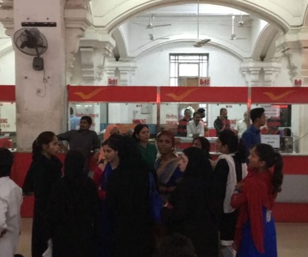  costumers turned angry after waitng for long in post office during currency change.