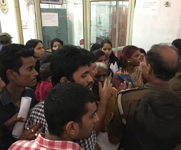  costumers turned angry after waitng for long in post office during currency change.