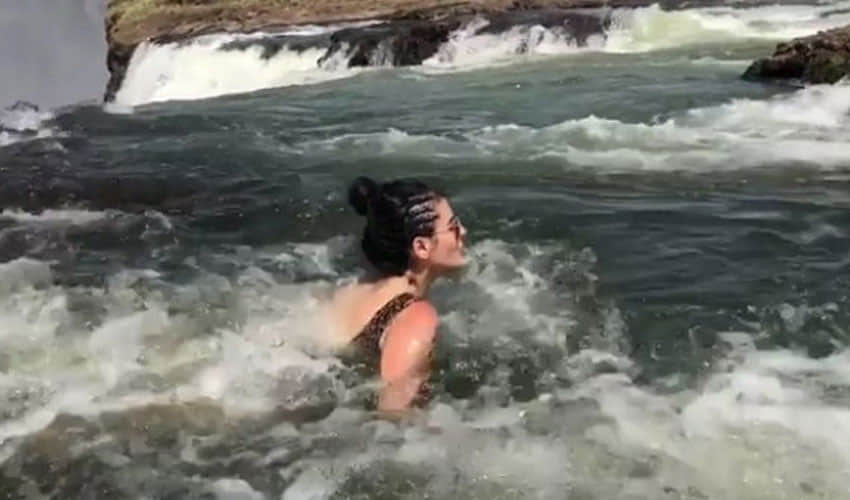 mandana karimi doing swimming in victoria waterfall