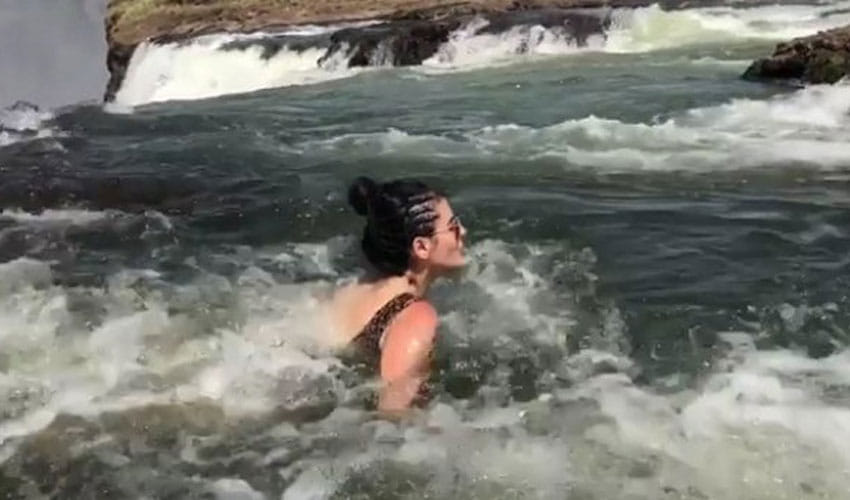 mandana karimi doing swimming in victoria waterfall