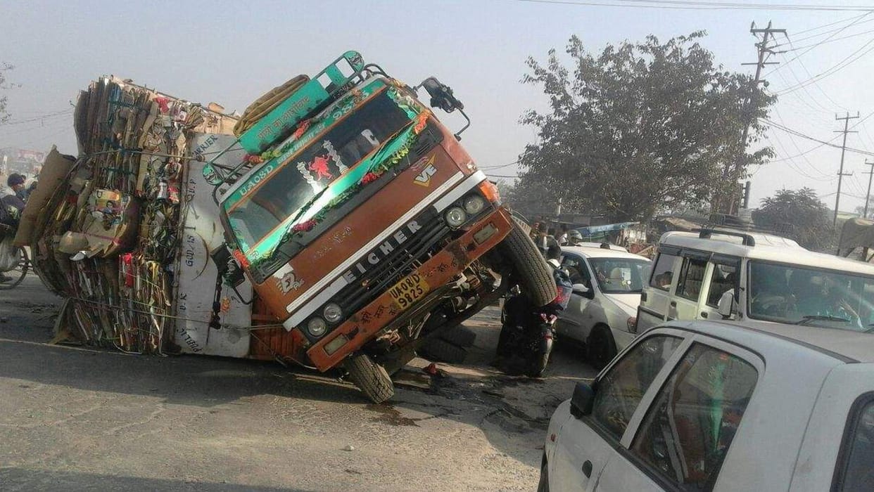 cardboard loaded truck turned down, no harm