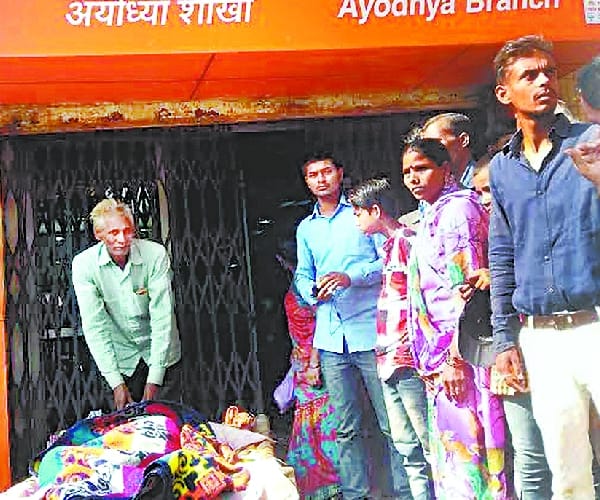 An old lady goes to take money from bank on cot.