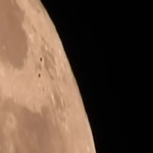  aliens flying over the moon