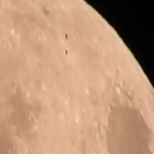  aliens flying over the moon