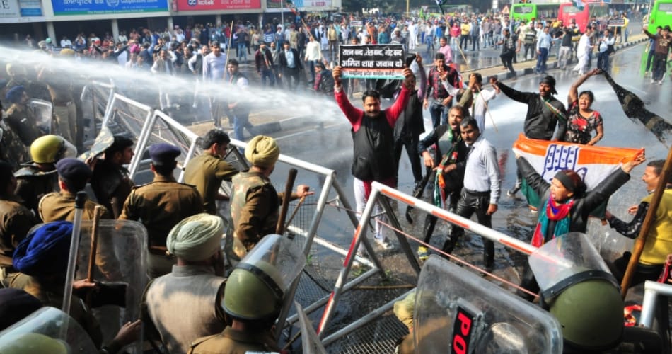congress workers protest against amit shah in chandigarh, police use water canon to stop them