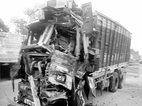 Truck collides with truck parked in front of the police station