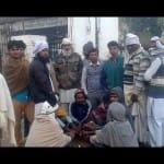 people in villages standing outside banks and waiting for notes in gurugram 
