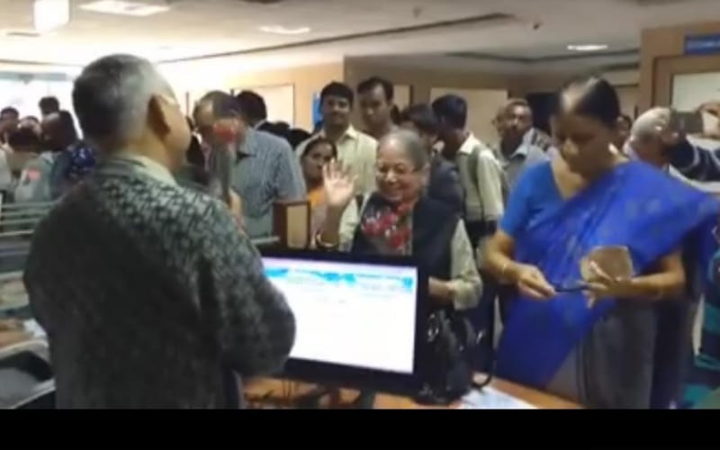  old lady gave flowers to state bank staff in lucknow