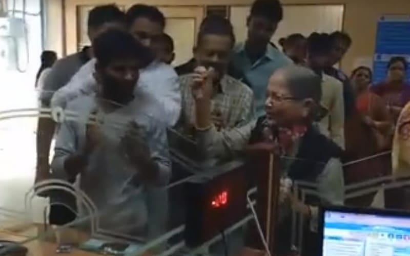  old lady gave flowers to state bank staff in lucknow