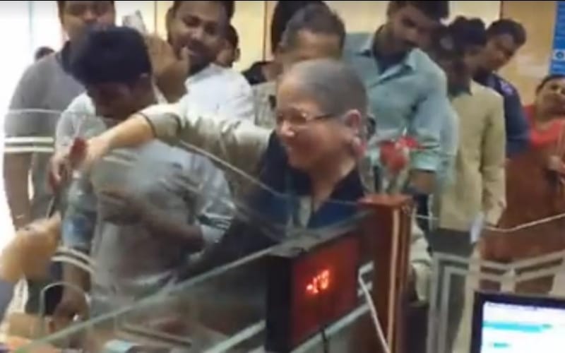  old lady gave flowers to state bank staff in lucknow